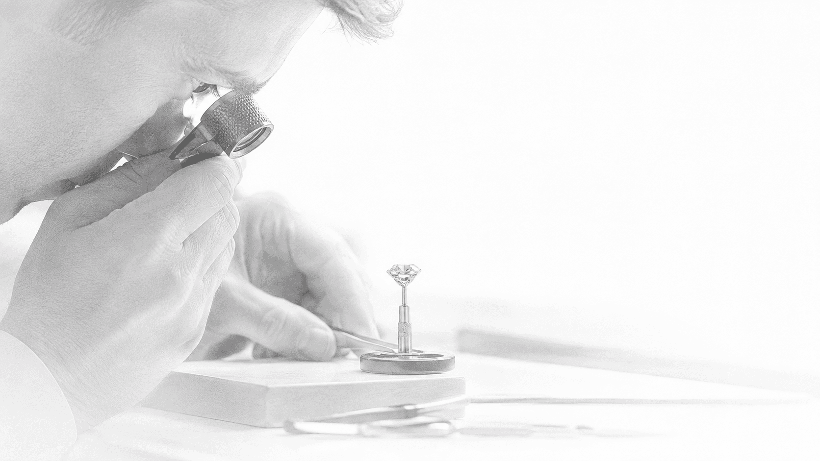 Close-up of a diamond being shaped on a precision cutting machine